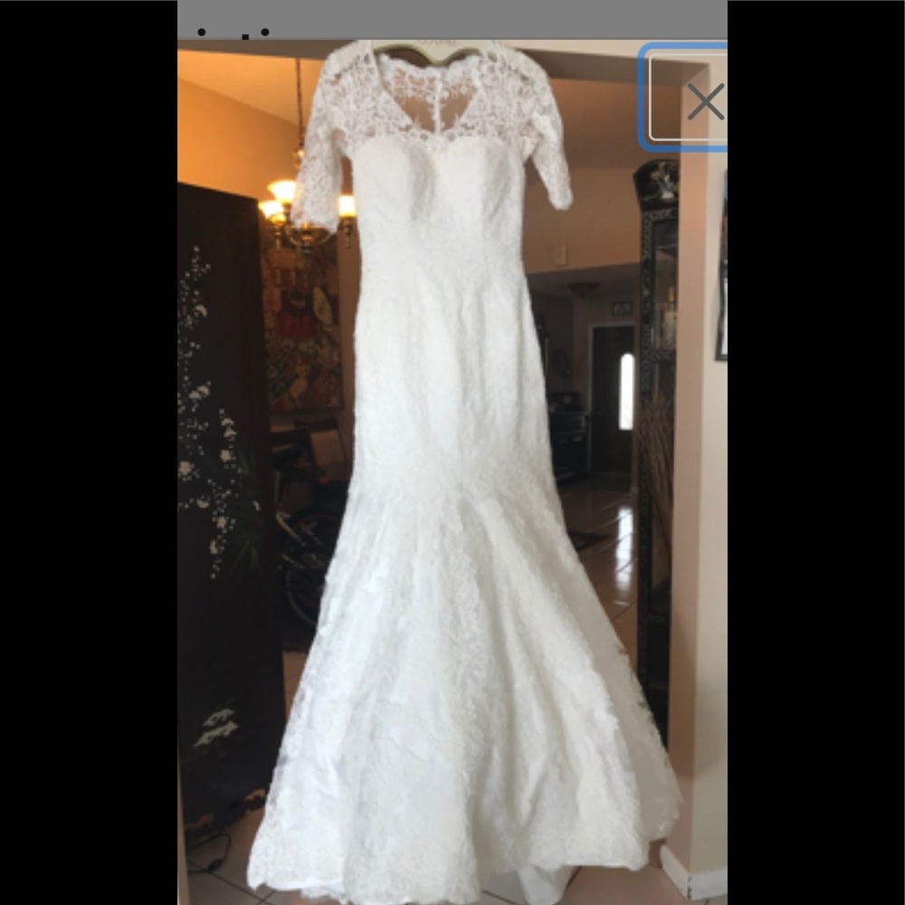 Beautiful guipure lace wedding dress perfectly laundered by professionals $600